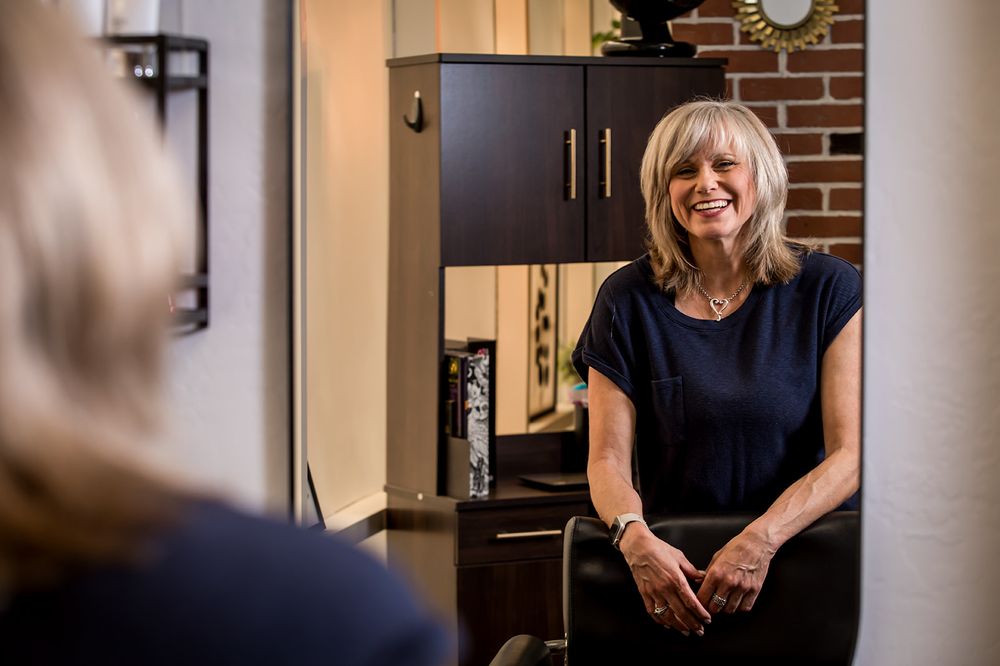 hairstylist looking in the mirror